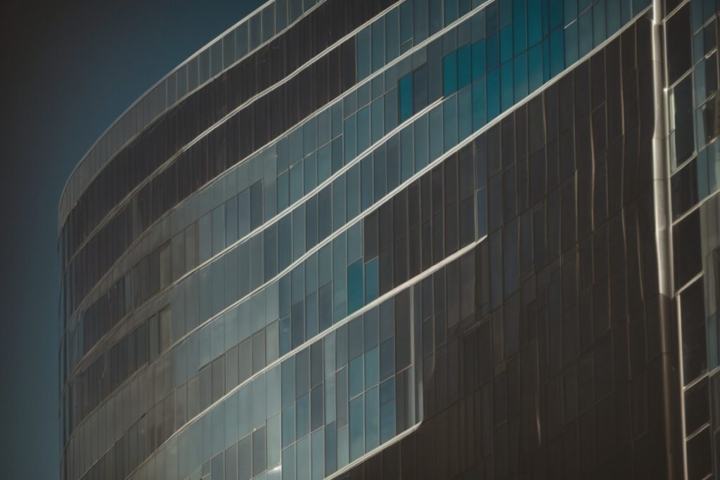 Oakland building with textured window film, soft ambient light inside